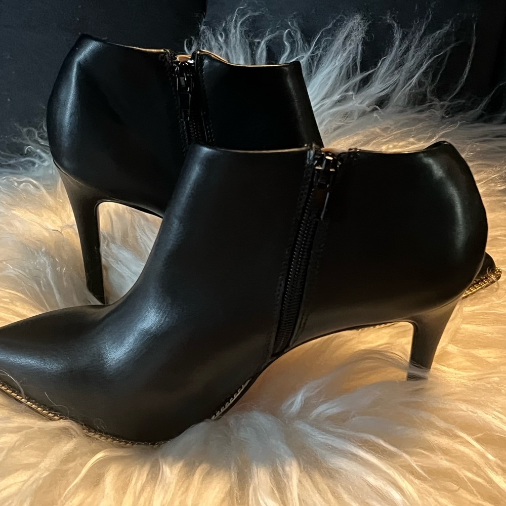 BCBGeneration Booties Black with Gold Chain rim New With Tag , Never worn.